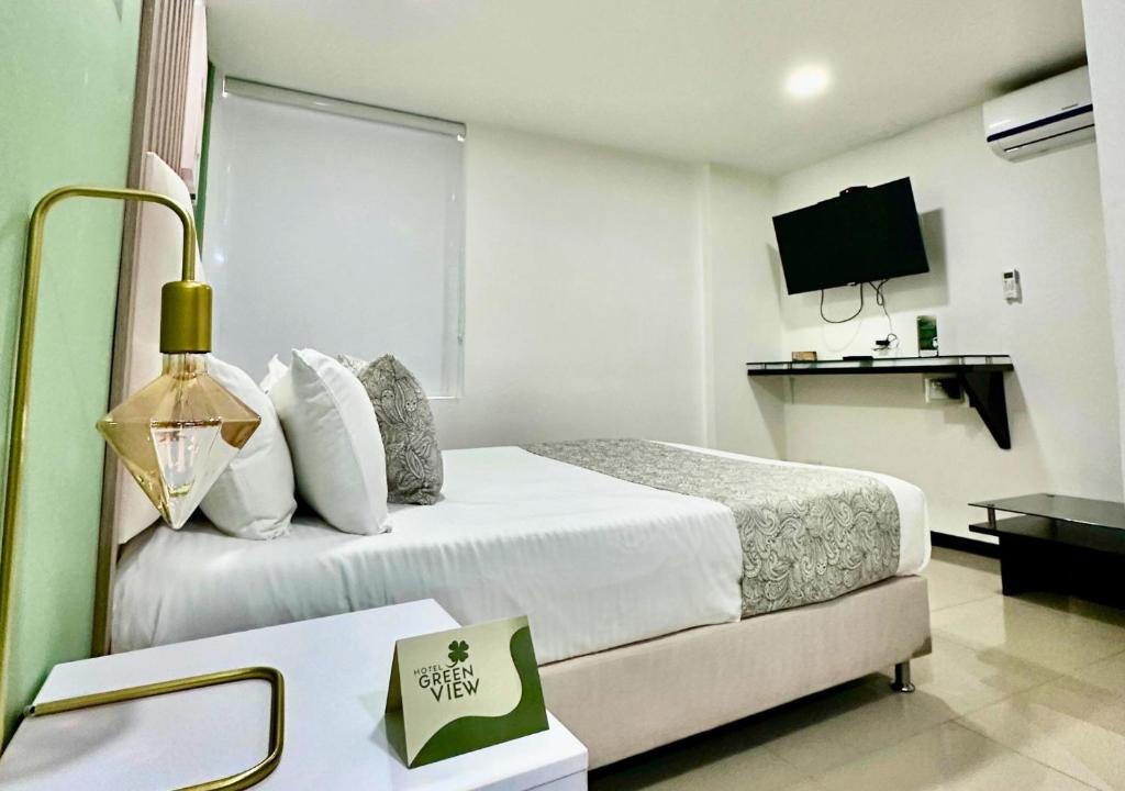 Postel nebo postele na pokoji v ubytování Greenview Medellin By St Hoteles