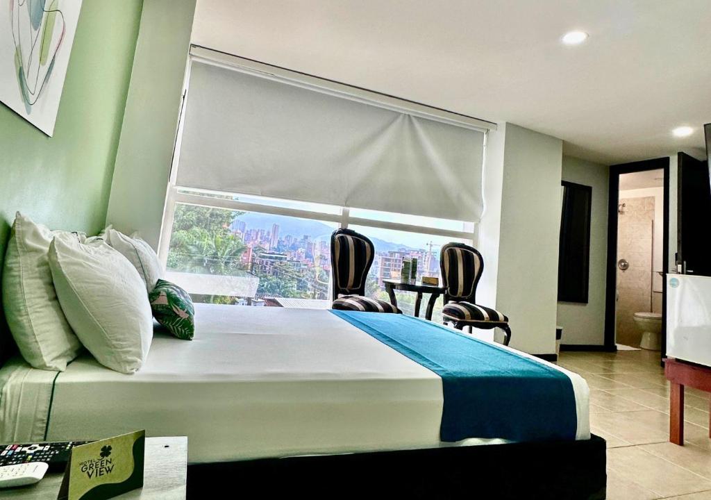 Postel nebo postele na pokoji v ubytování Greenview Medellin By St Hoteles
