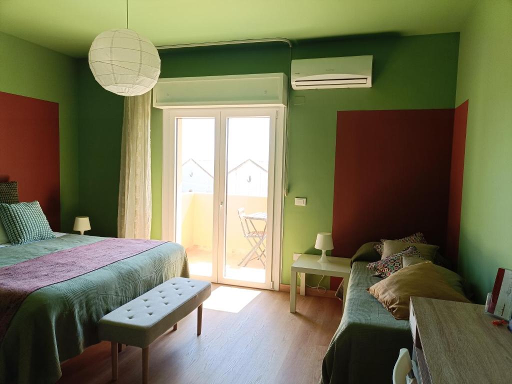 Postel nebo postele na pokoji v ubytování B&B Sbarco dei 1000