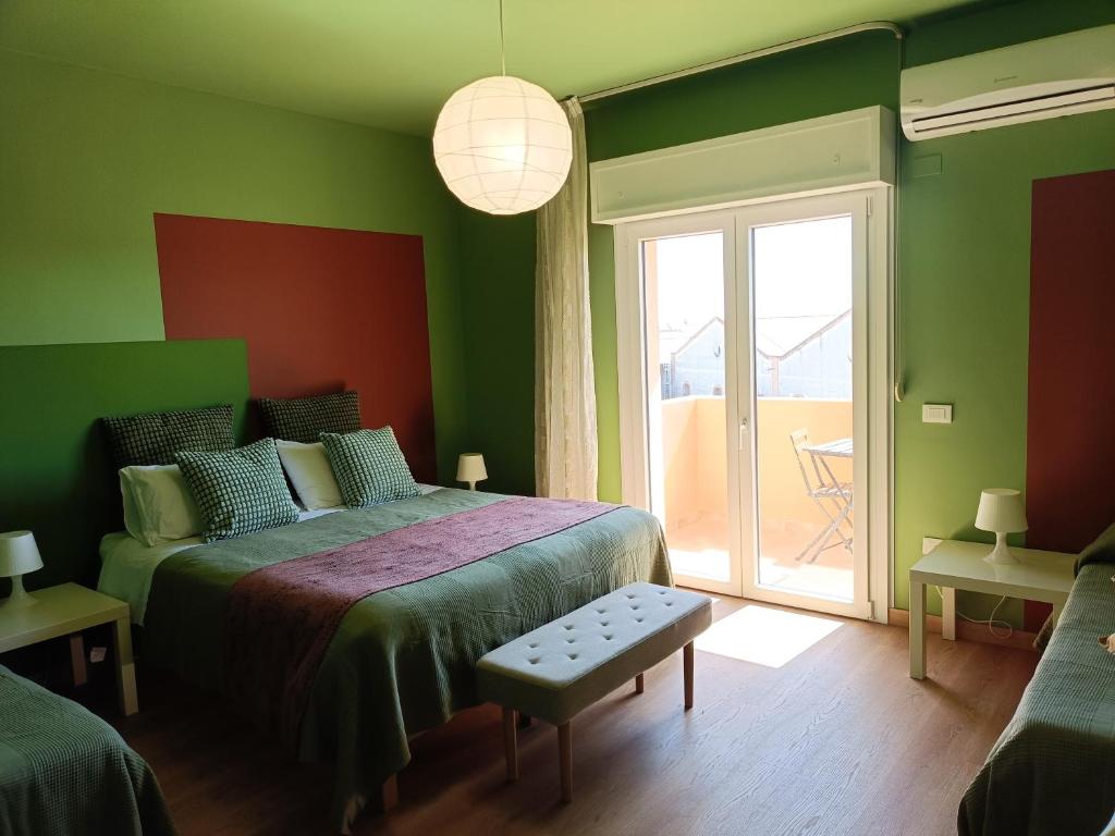 Postel nebo postele na pokoji v ubytování B&B Sbarco dei 1000