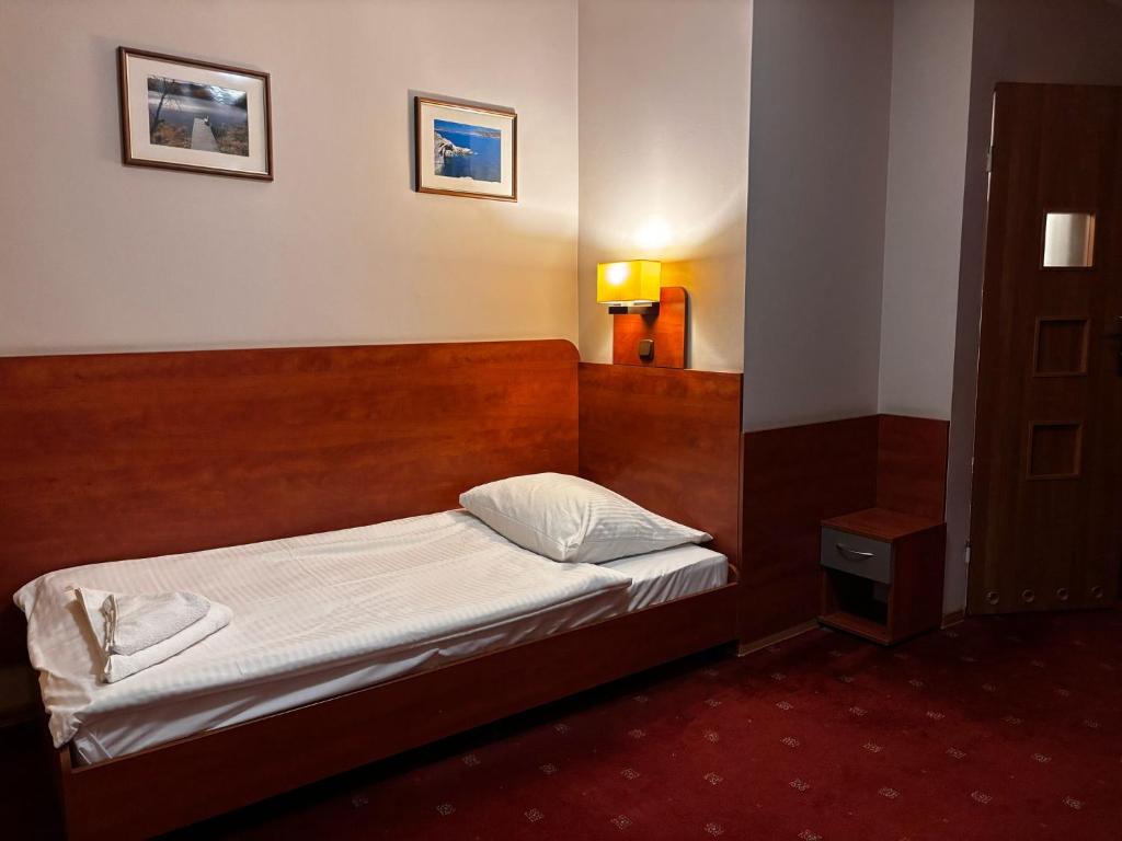 Postel nebo postele na pokoji v ubytování Hotel Orion