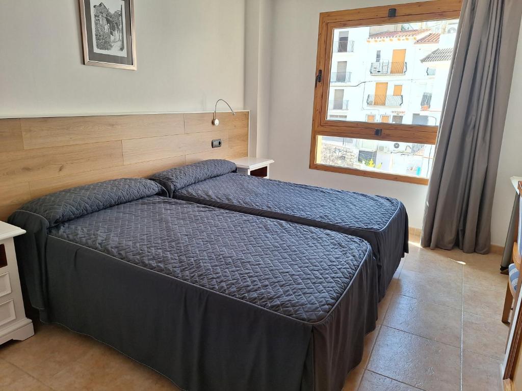 Cama o camas de una habitación en Hotel Xauen