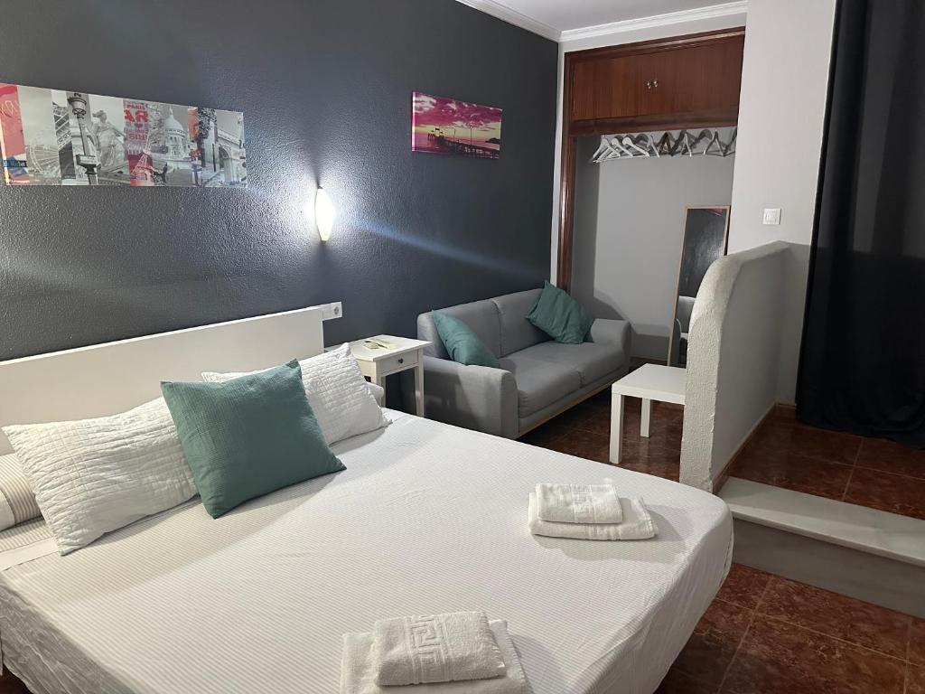Posteľ alebo postele v izbe v ubytovaní Apartamentos & Rooms JP