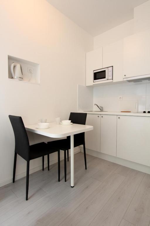 Kuchyň nebo kuchyňský kout v ubytování Apartments Simple Teslina