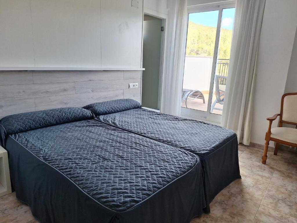 Cama o camas de una habitación en Hotel Xauen