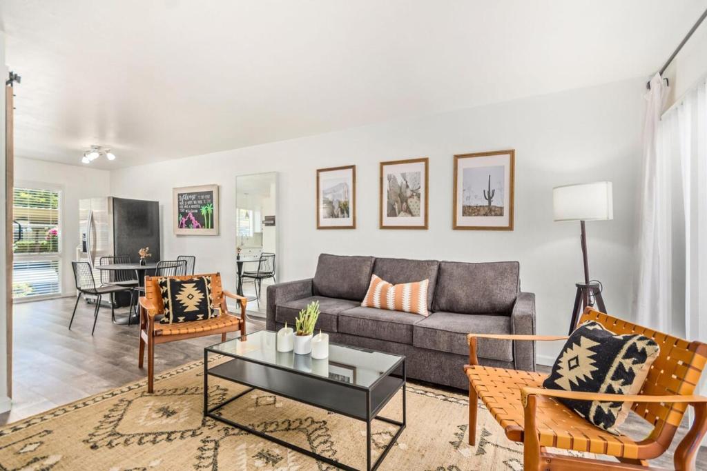 a living room with a couch and a table at Camelback 446 at Fashion Square in Scottsdale