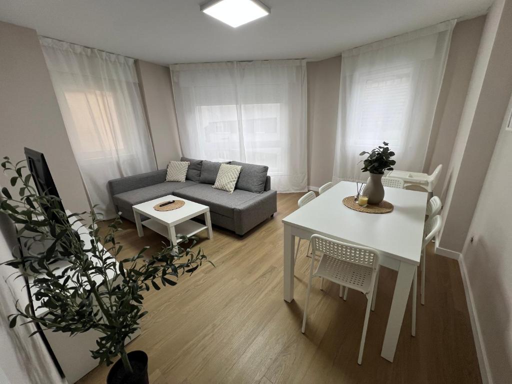 a living room with a couch and a table at mar in Moaña