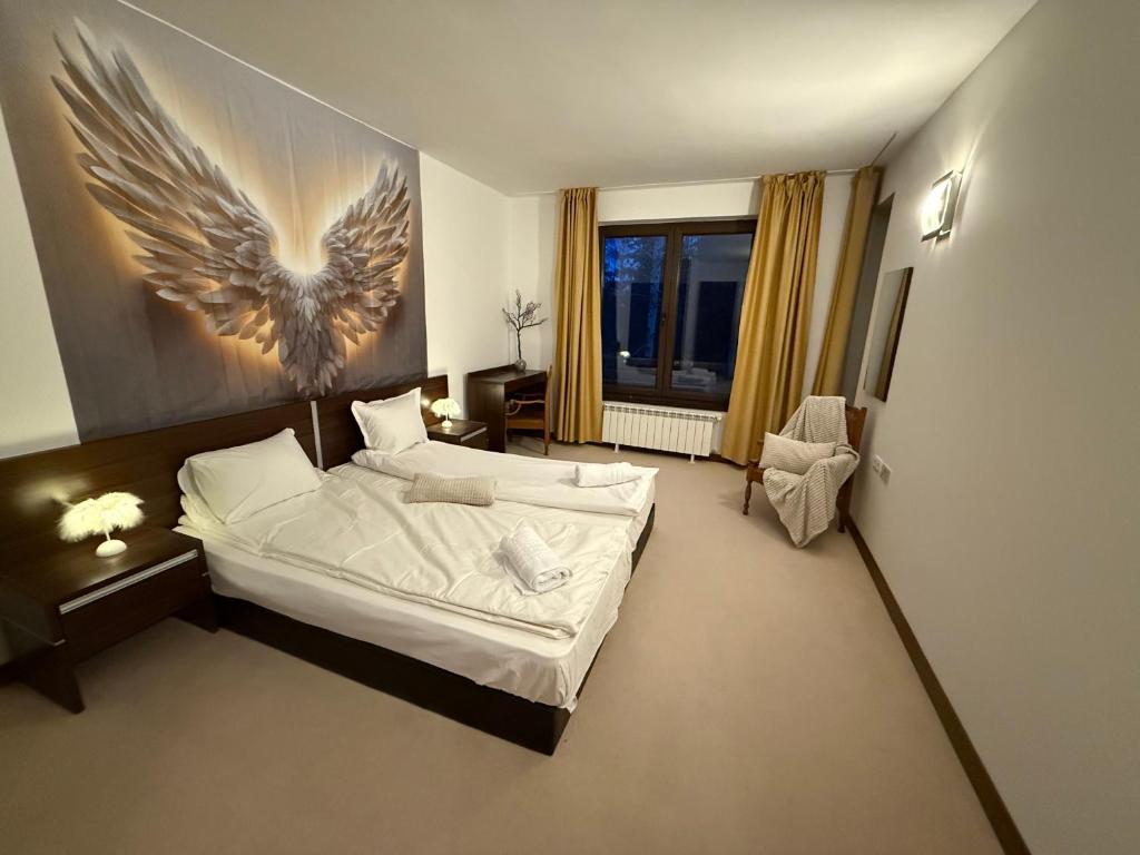 Postel nebo postele na pokoji v ubytování SPA, Ski and Golf all seasons huge apartament near Bansko