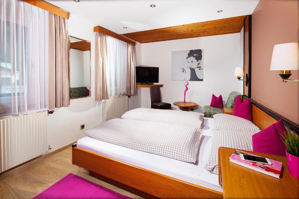 Postel nebo postele na pokoji v ubytování Hotel Apartment Das Au- Gut