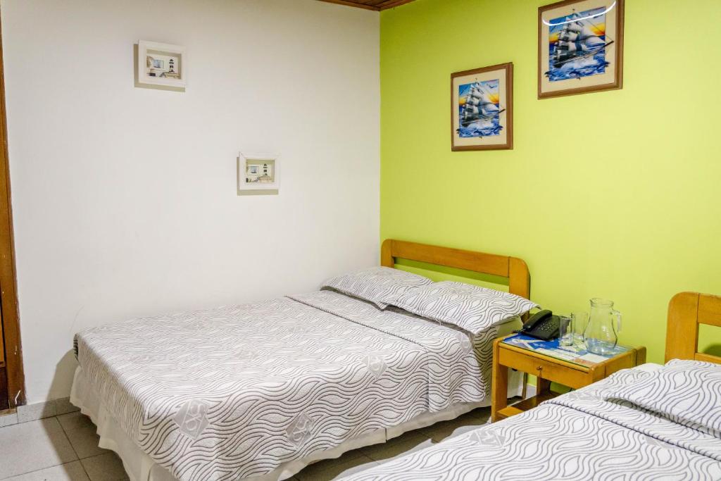 Postel nebo postele na pokoji v ubytování Hotel Veleros Cartagena