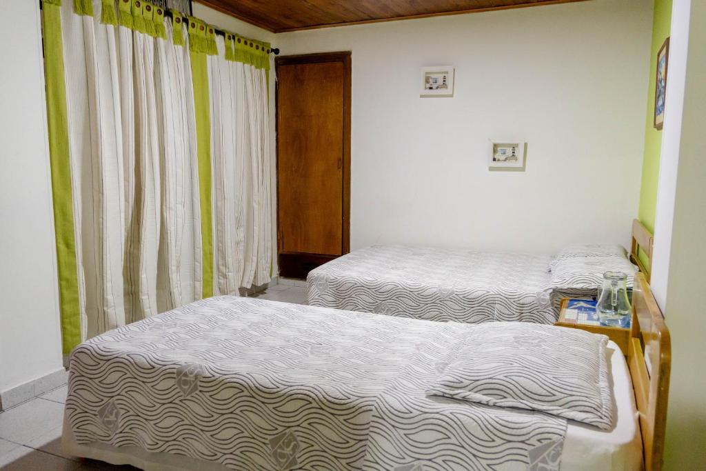 Postel nebo postele na pokoji v ubytování Hotel Veleros Cartagena