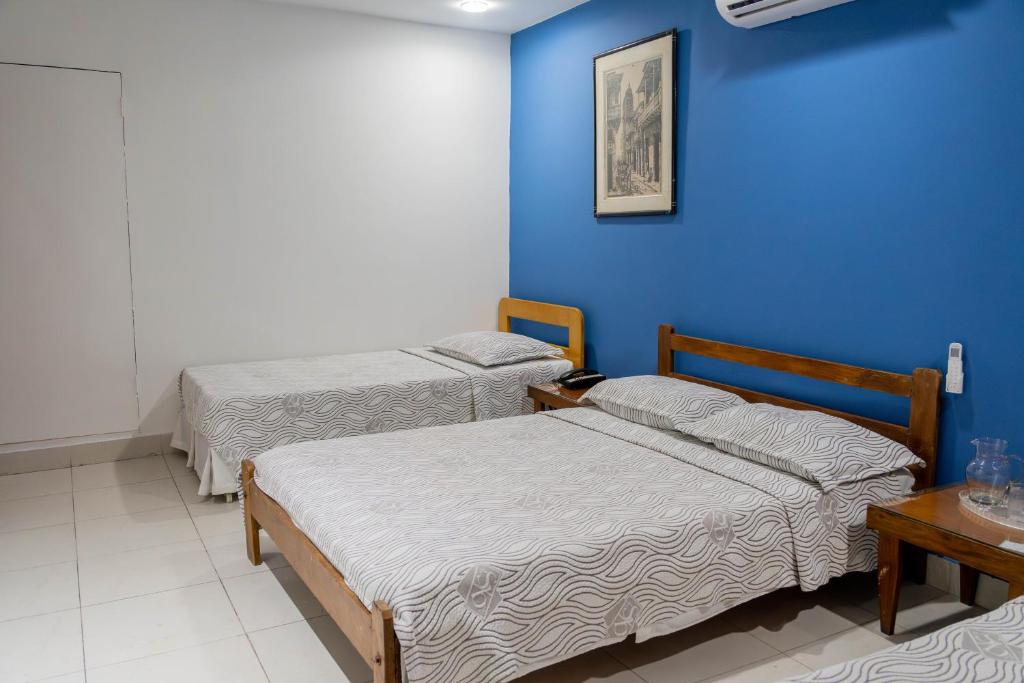 Postel nebo postele na pokoji v ubytování Hotel Veleros Cartagena