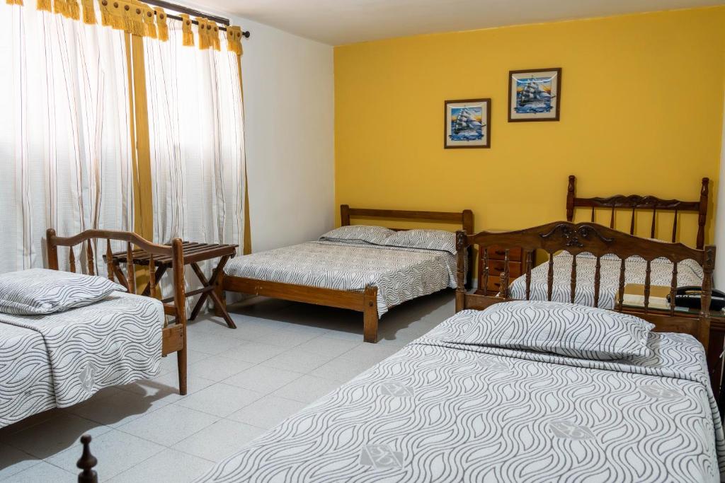 Postel nebo postele na pokoji v ubytování Hotel Veleros Cartagena