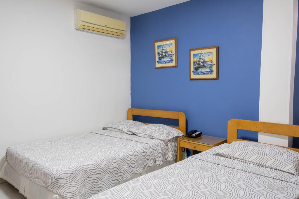 Postel nebo postele na pokoji v ubytování Hotel Veleros Cartagena