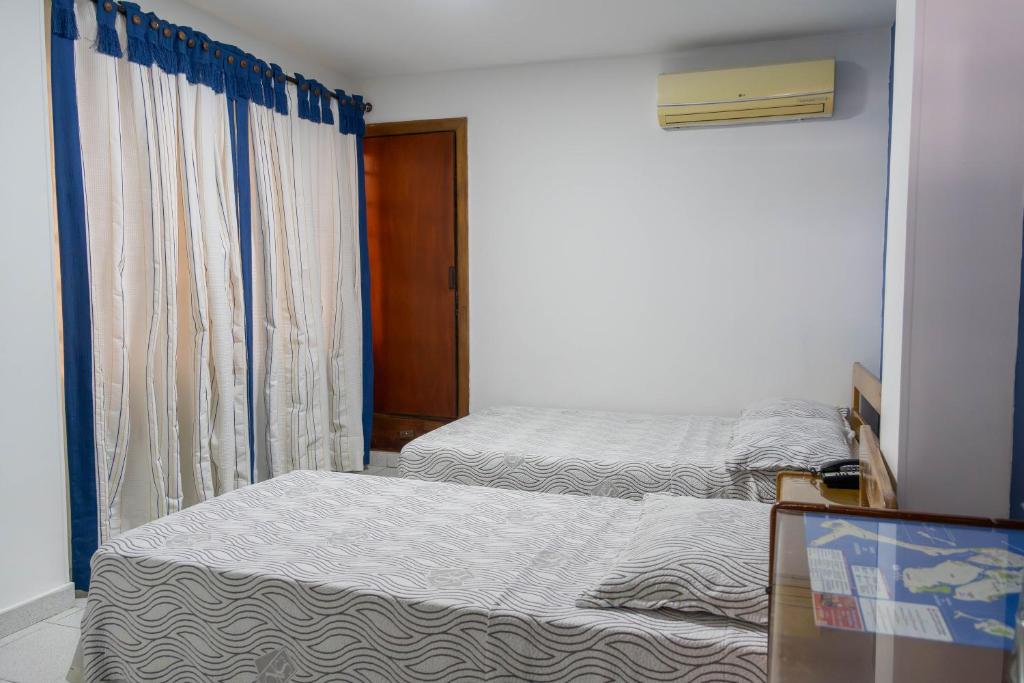 Postel nebo postele na pokoji v ubytování Hotel Veleros Cartagena