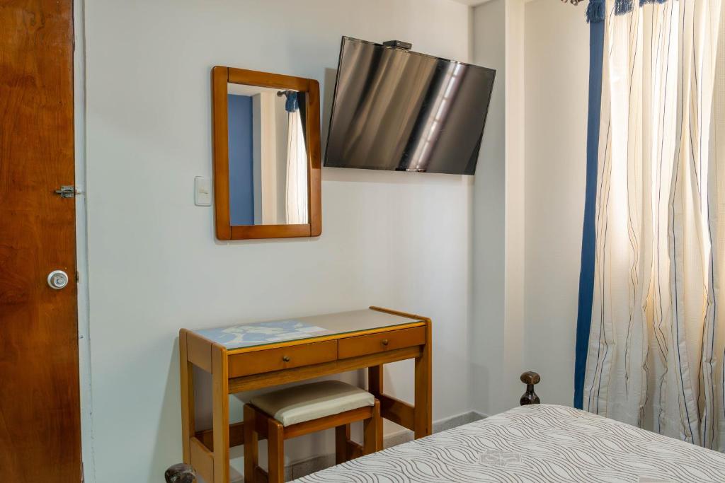 Postel nebo postele na pokoji v ubytování Hotel Veleros Cartagena