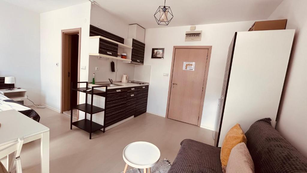 a small apartment with a kitchen and a living room at Rainbow 3-213 Large Studio Delux in Sunny Beach