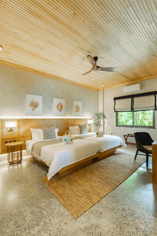 Voodi või voodid majutusasutuse Manami Resort toas