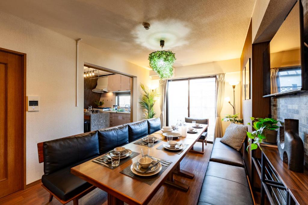 a living room with a table and a couch at Premier suite Shinjuku okubo Tokyo 3F in Tokyo