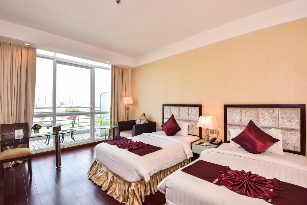 Postel nebo postele na pokoji v ubytování Dara Airport Hotel