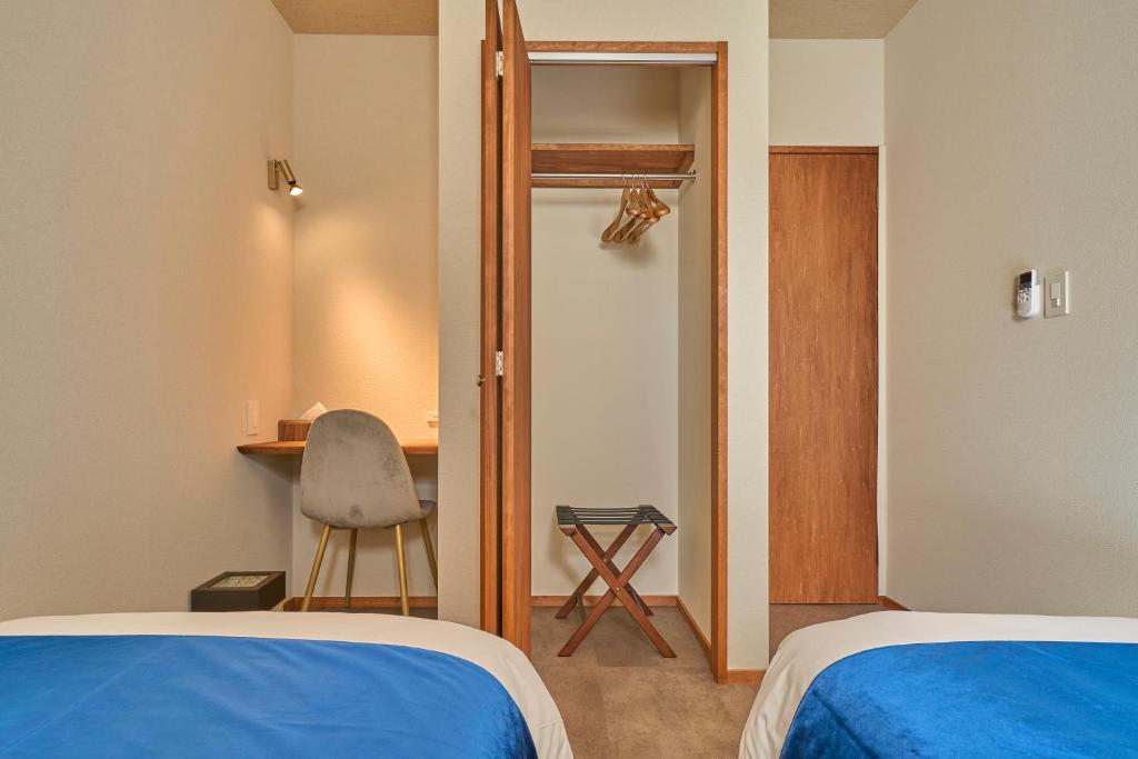 Postel nebo postele na pokoji v ubytování VILLA SENSE kujukuri