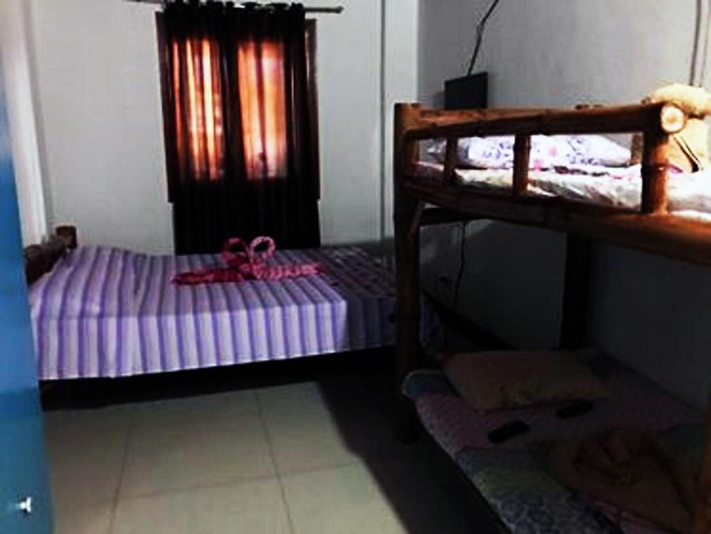Postel nebo postele na pokoji v ubytování Cebu Guest Inn