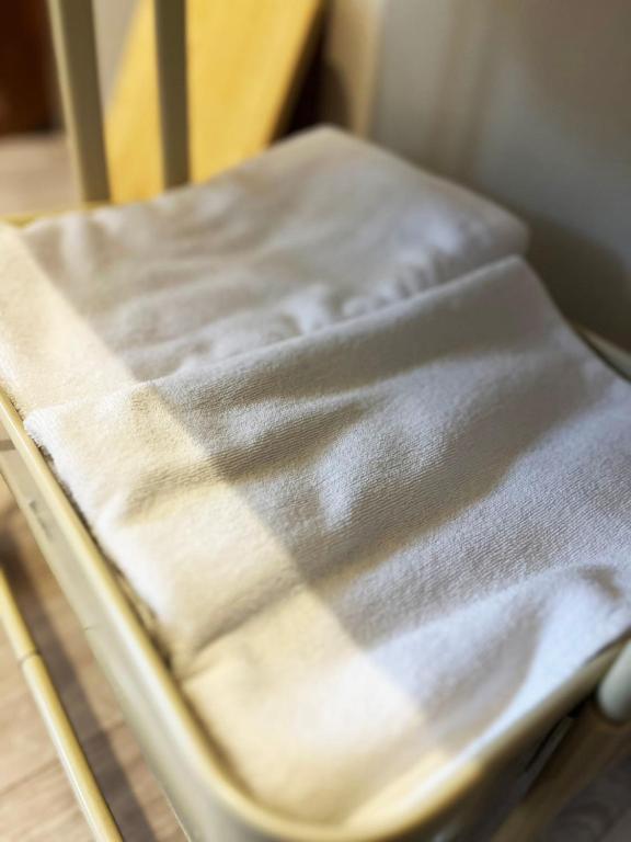 Postel nebo postele na pokoji v ubytování アラン別邸自然溢れる呼人の一軒家