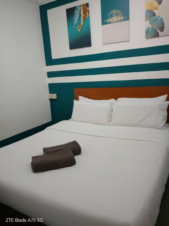 Postel nebo postele na pokoji v ubytování Apollo hotel