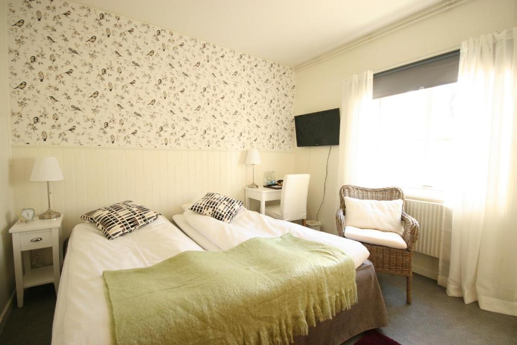 Postel nebo postele na pokoji v ubytování Nynäsgården Hotell & Konferens