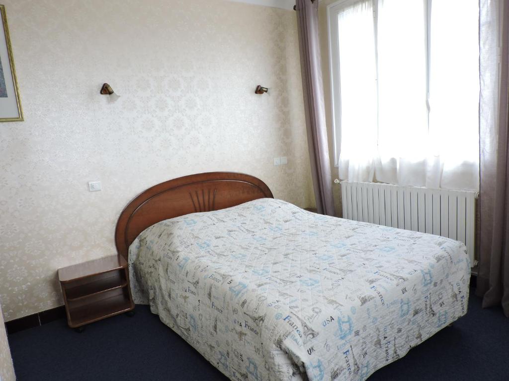 Postel nebo postele na pokoji v ubytování Belvedere Montargis Amilly