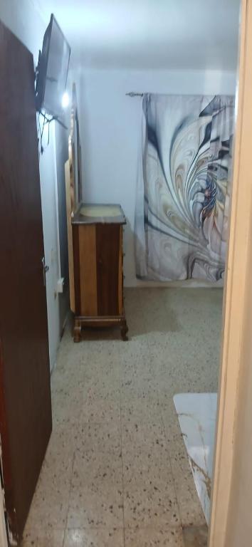 TV o dispositivi per l'intrattenimento presso Holiday Rooms in Port Morant St Thomas Jamaica