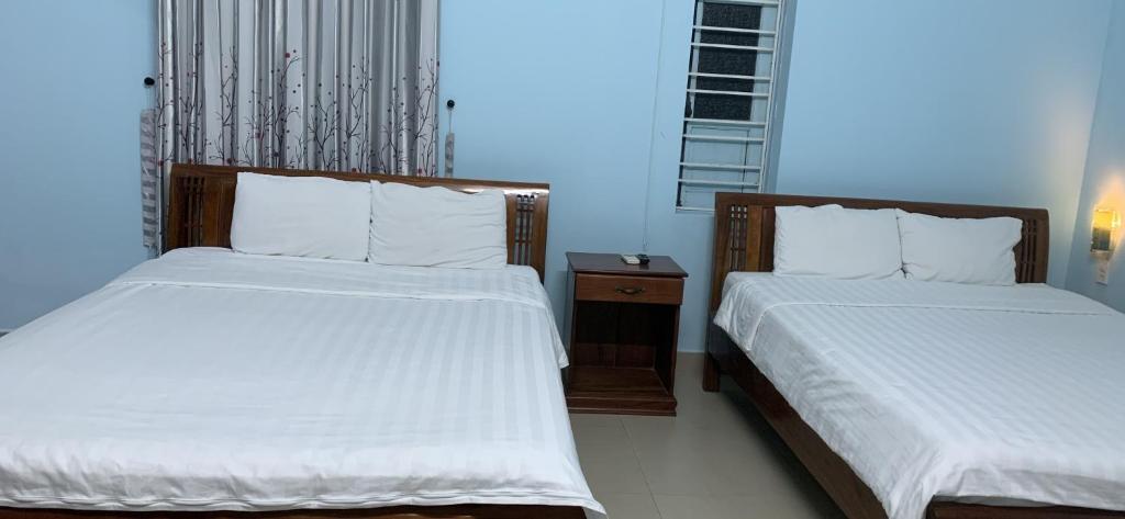Postel nebo postele na pokoji v ubytování Areca Homestay