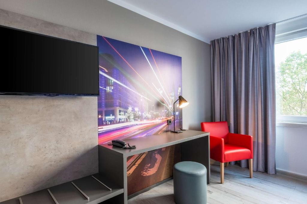 TV a/nebo společenská místnost v ubytování Hotel Berlin Lichtenberg