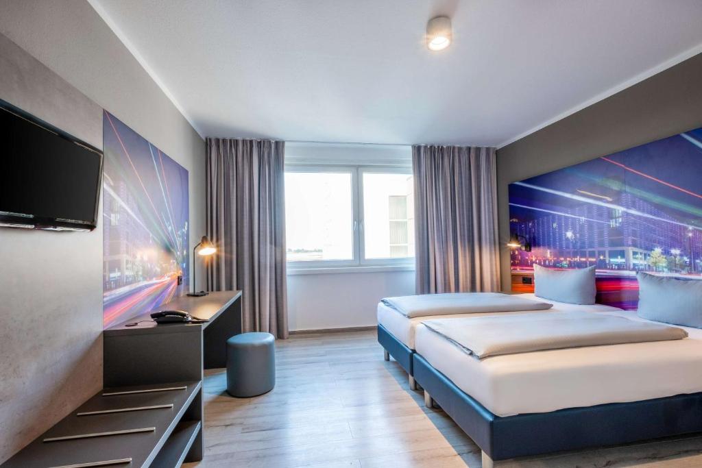 Postel nebo postele na pokoji v ubytování Hotel Berlin Lichtenberg