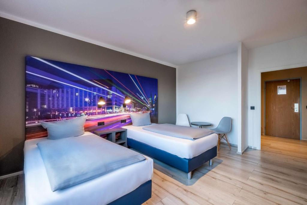 Postel nebo postele na pokoji v ubytování Hotel Berlin Lichtenberg