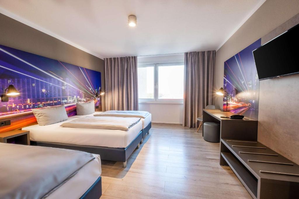 Postel nebo postele na pokoji v ubytování Hotel Berlin Lichtenberg