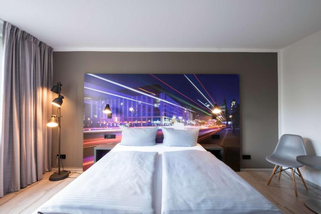 Postel nebo postele na pokoji v ubytování Hotel Berlin Lichtenberg