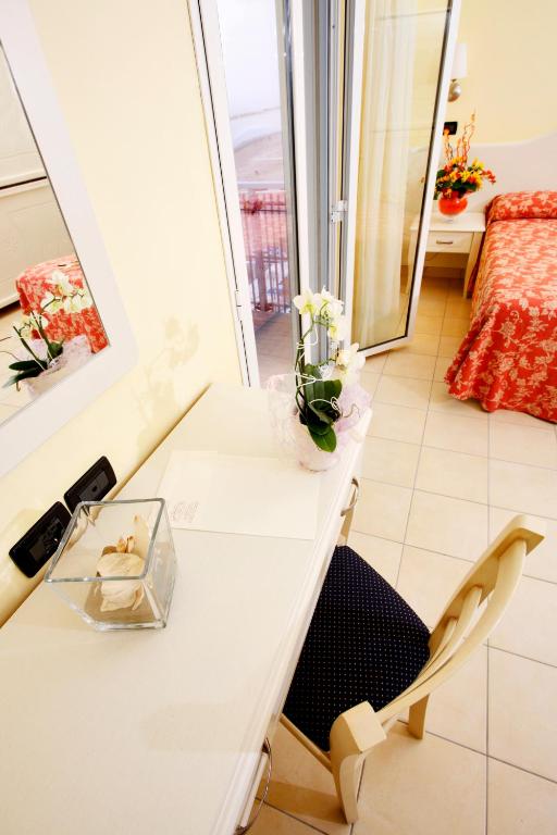 Postel nebo postele na pokoji v ubytování Hotel Baia