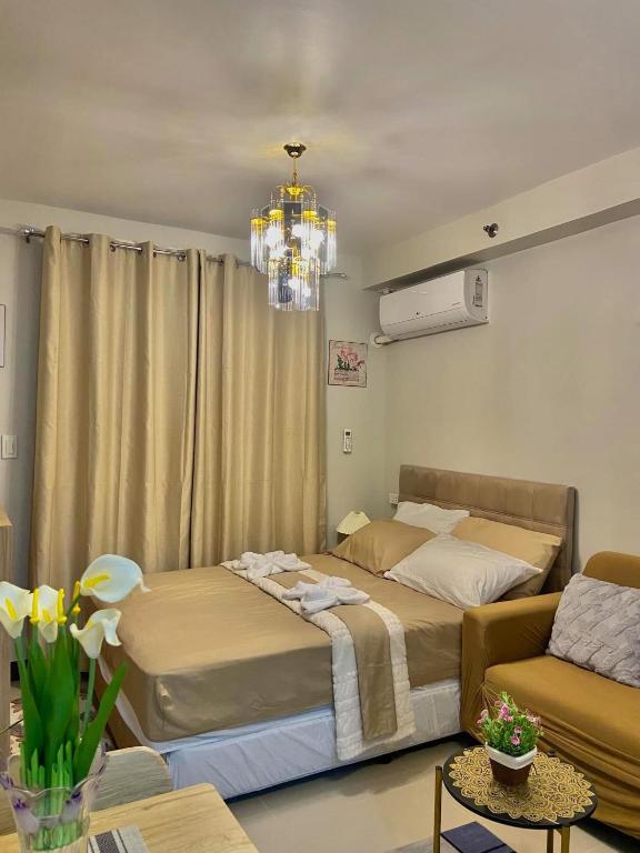 Postel nebo postele na pokoji v ubytování Saekyung Village Condominium Phase 301