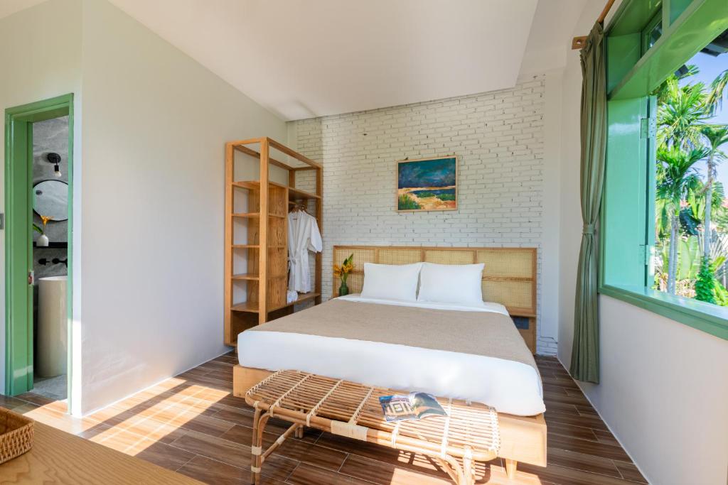 Postel nebo postele na pokoji v ubytování Manling Retreat Hoi An