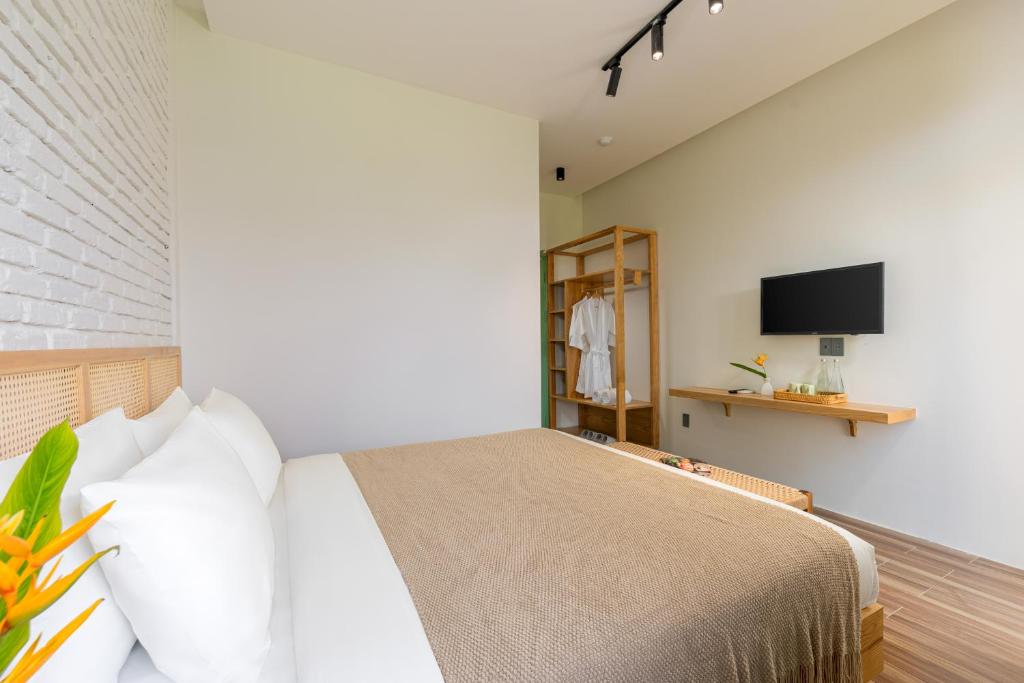 TV a/nebo společenská místnost v ubytování Manling Retreat Hoi An