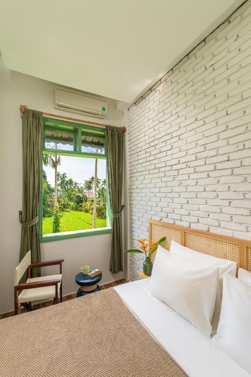 Postel nebo postele na pokoji v ubytování Manling Retreat Hoi An