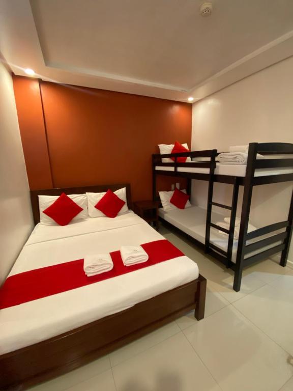 Postel nebo postele na pokoji v ubytování Royale Parc Hotel Puerto Princesa Palawan