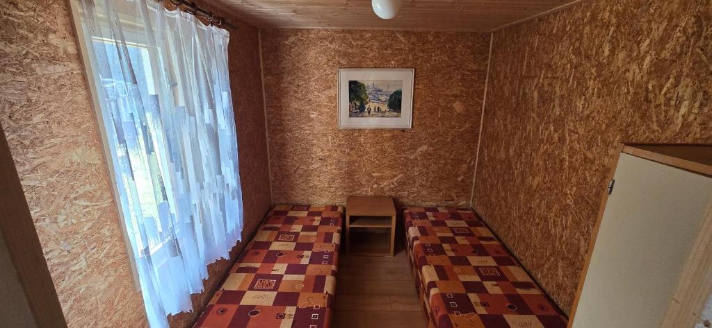 Postel nebo postele na pokoji v ubytování Wodolenka