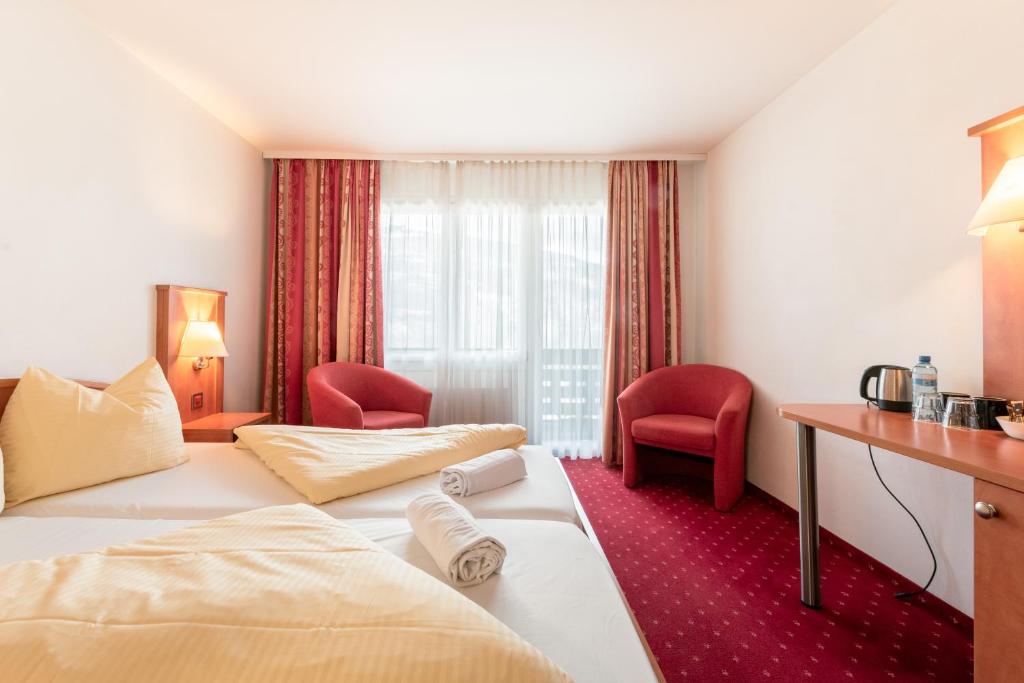 Postel nebo postele na pokoji v ubytování Hotel Kreuz