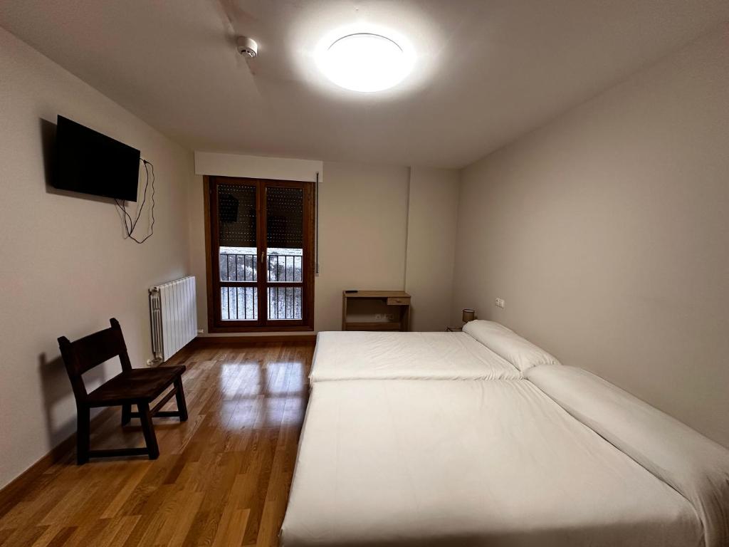 Posteľ alebo postele v izbe v ubytovaní Hostal Rural 18 de Abril