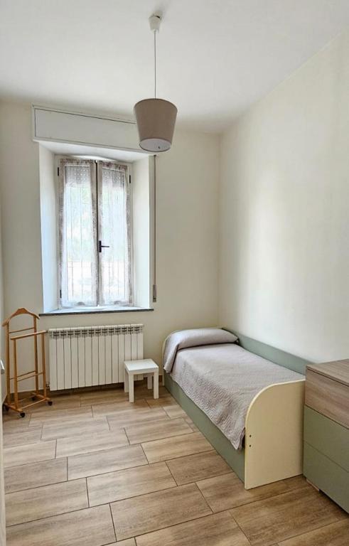Postel nebo postele na pokoji v ubytování Appartamento Granella
