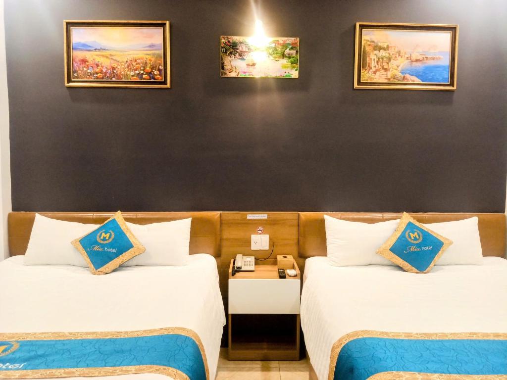 Postel nebo postele na pokoji v ubytování Mia Hotel Vũng Tàu
