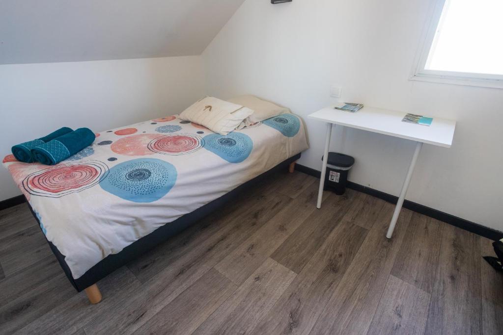 Postel nebo postele na pokoji v ubytování LES AGAPANTHES du 27 -ème