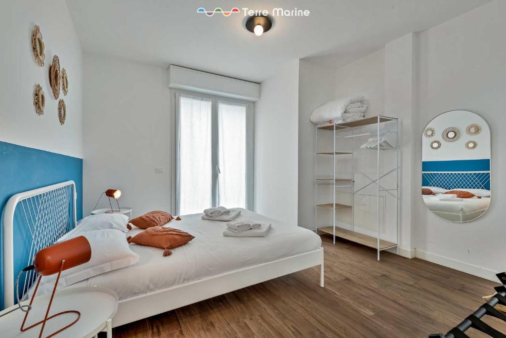 Łóżko lub łóżka w pokoju w obiekcie Subalterno33, Terre Marine